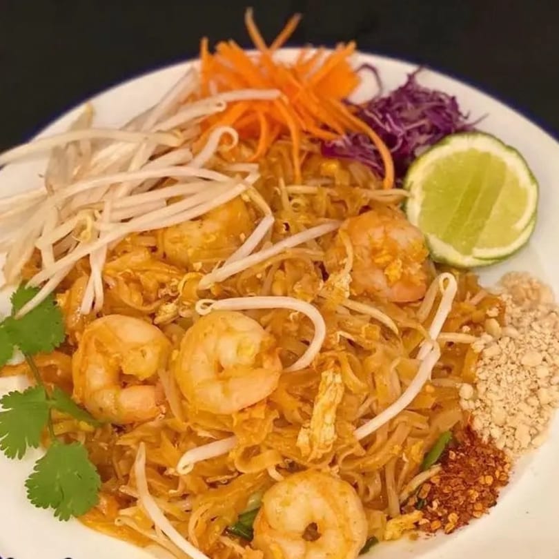Tamarind Thai Cuisine's Pad Thai with shrimp, bean sprouts, shredded carrots, lime, and crushed peanuts.